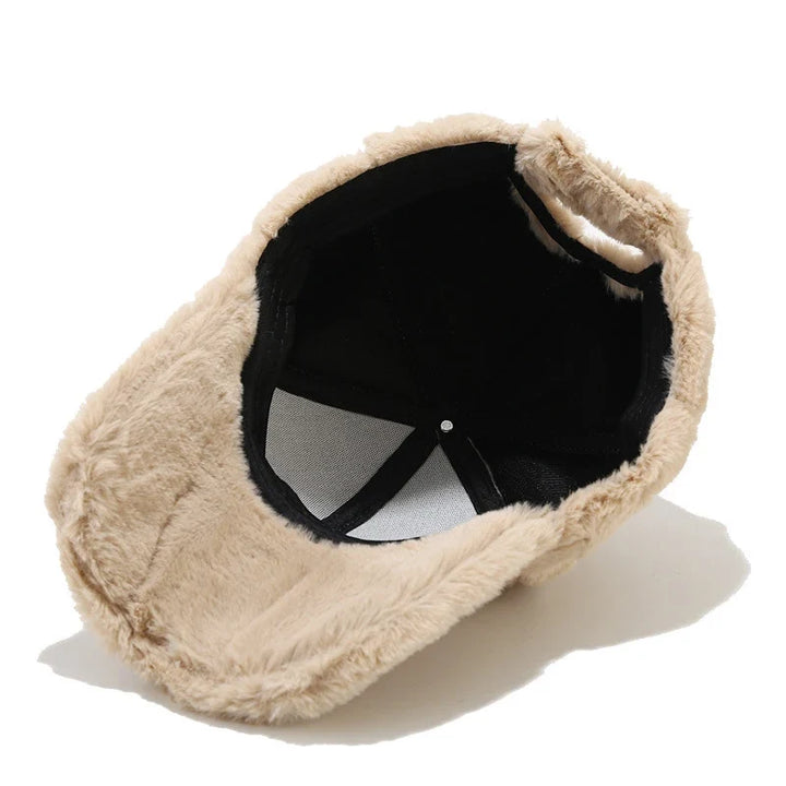 Cozy women's plush faux fur hat, a versatile winter accessory. Stay warm with this stylish cap.
