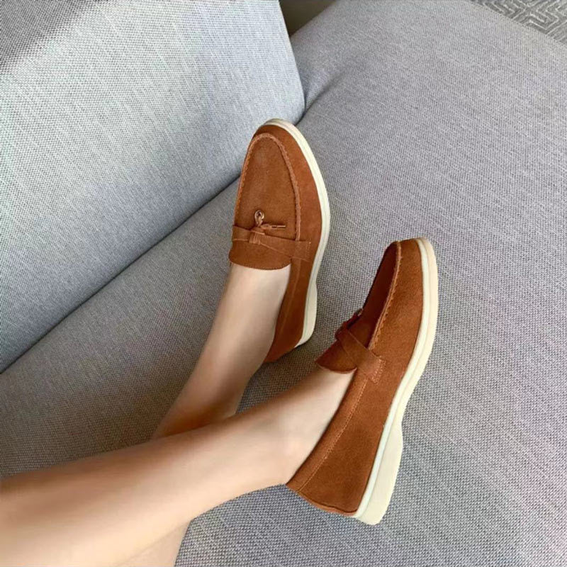 Comfortable women's slip-on loafers featuring a chic decorative clasp, perfect for casual or dressy styles.
