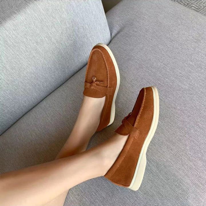 Comfortable women's slip-on loafers featuring a chic decorative clasp, perfect for casual or dressy styles.