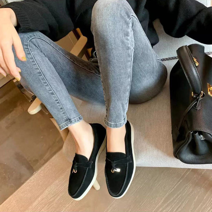Elegant women's loafers with unique metallic clasp detail, designed for ultimate comfort and fashion appeal.