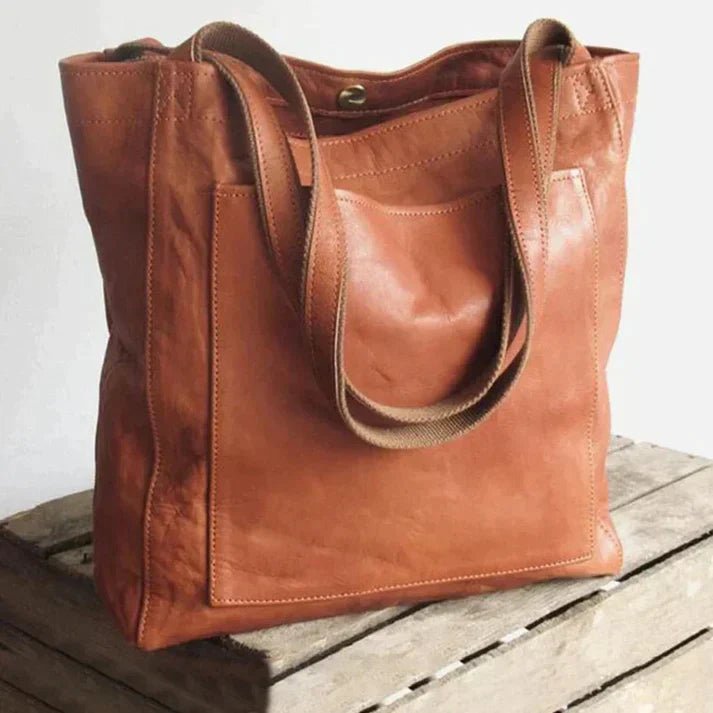 Stylish brown women's crossbody bag with adjustable strap, perfect daily handbag & travel accessory for elegant fashion.