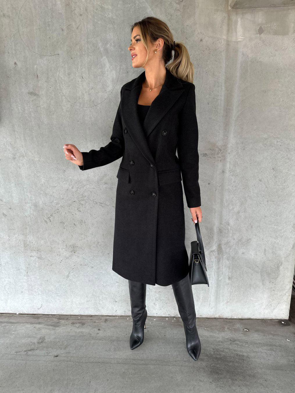 Women's cozy Vivienne long winter coat, hooded & with elegant button closure. Stylish and warm outerwear.