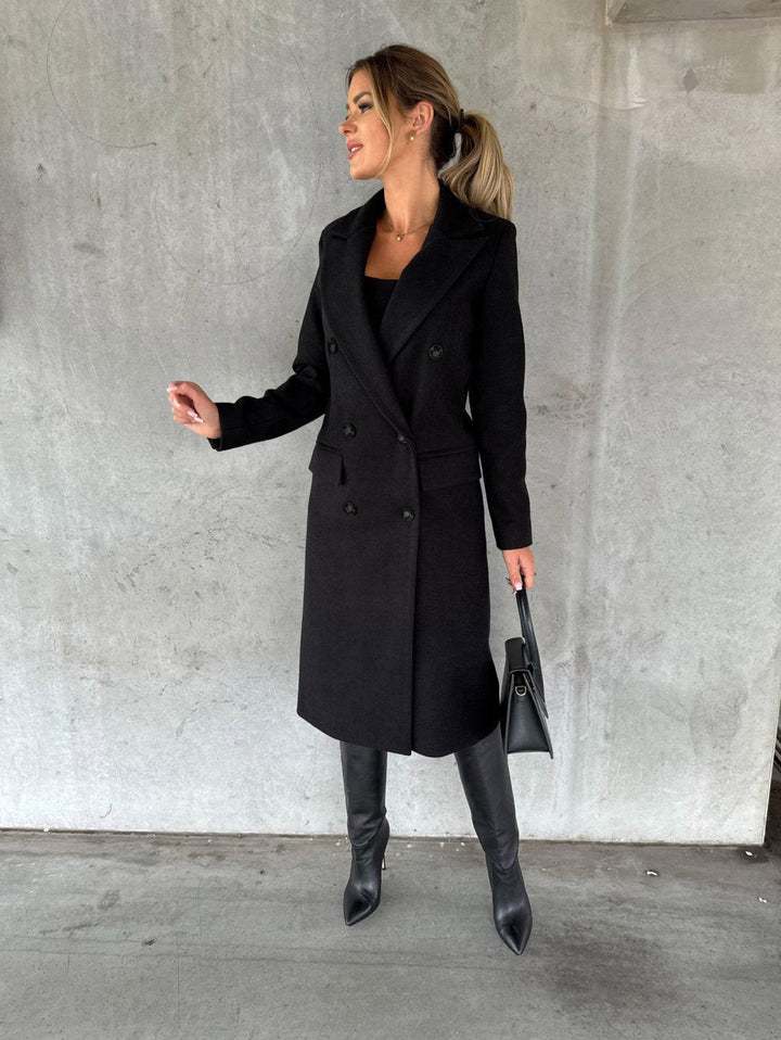 Women's cozy Vivienne long winter coat, hooded & with elegant button closure. Stylish and warm outerwear.