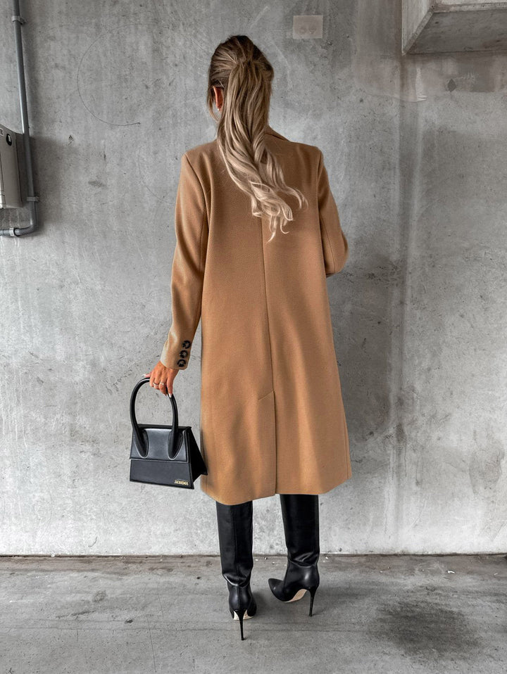 Fashionable women's Vivienne long winter coat. Elegant & cozy outerwear with button closure for winter style.