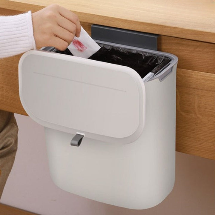 Stylish compact white plastic kitchen waste bin; modern design, perfect for space-saving home organization.