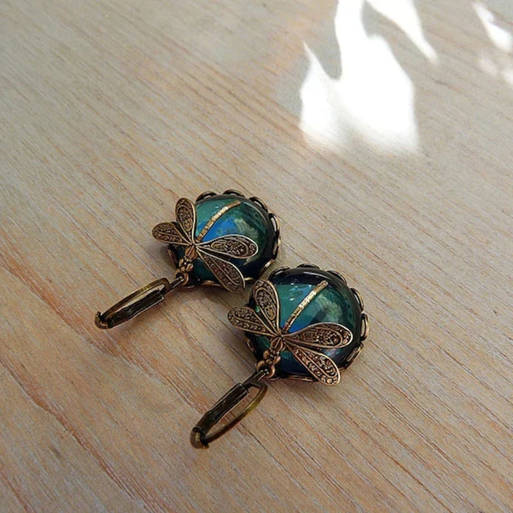 Elegant vintage-style antique gold drop earrings for women, featuring sparkling crystals.