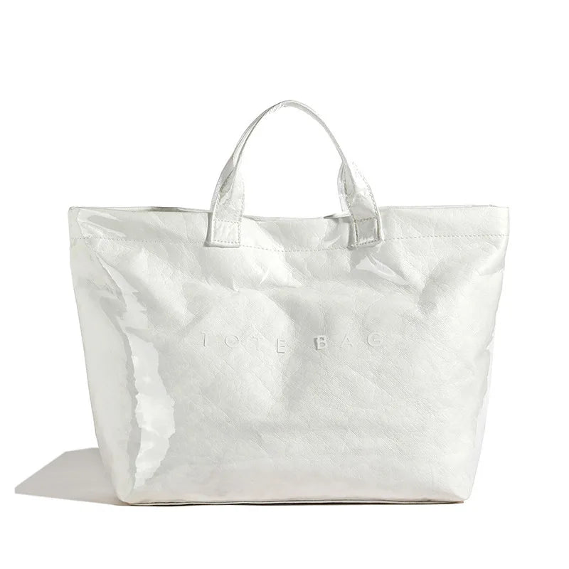 Eye-catching glossy women's tote bag, a stylish and durable everyday handbag.