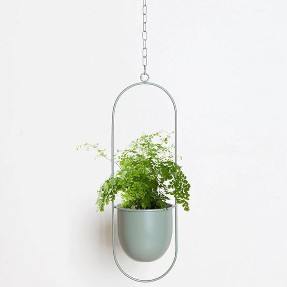 Sleek metal hanging plant holder, a minimalist design for stylish indoor/outdoor decor.