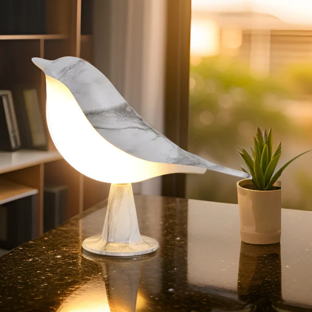 Stylish LED bird table lamp with touch controls for brightness & an integrated aromatherapy feature.
