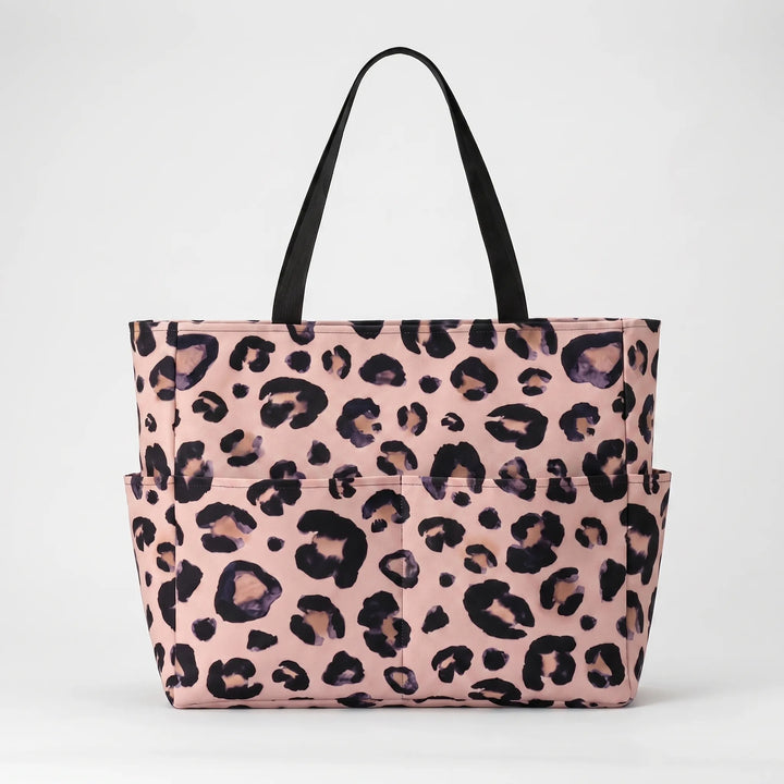 Large women's leopard print shoulder bag, ideal as a fashionable and organized beach accessory.