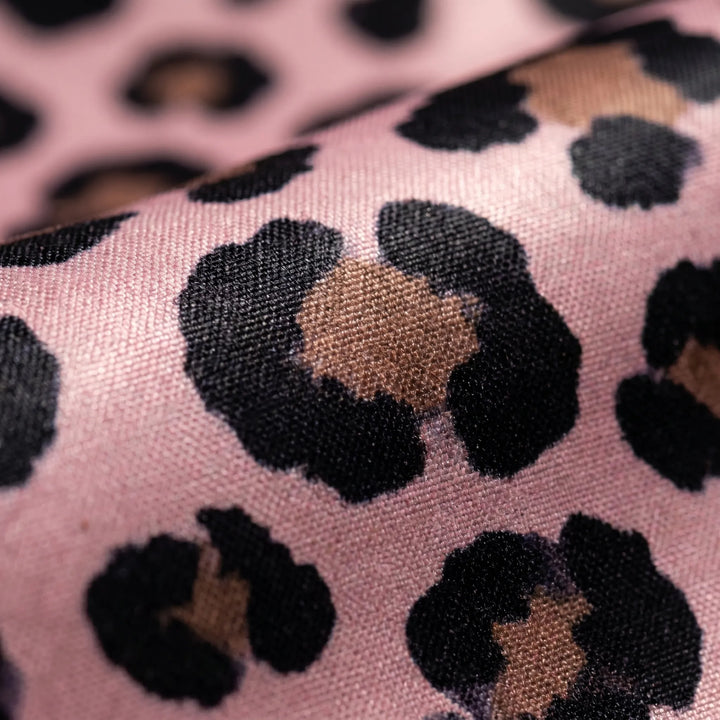 Spacious leopard print travel tote, a chic and practical bag for beach trips and summer outings.