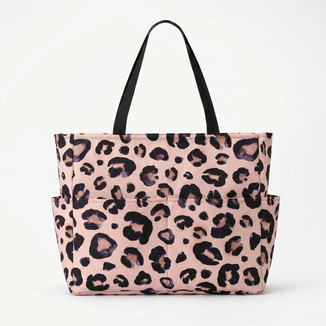 Fashionable women's leopard beach tote, featuring a trendy print and roomy interior for essentials.