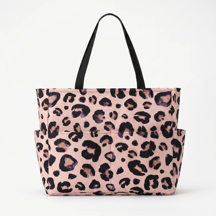 Fashionable women's leopard beach tote, featuring a trendy print and roomy interior for essentials.
