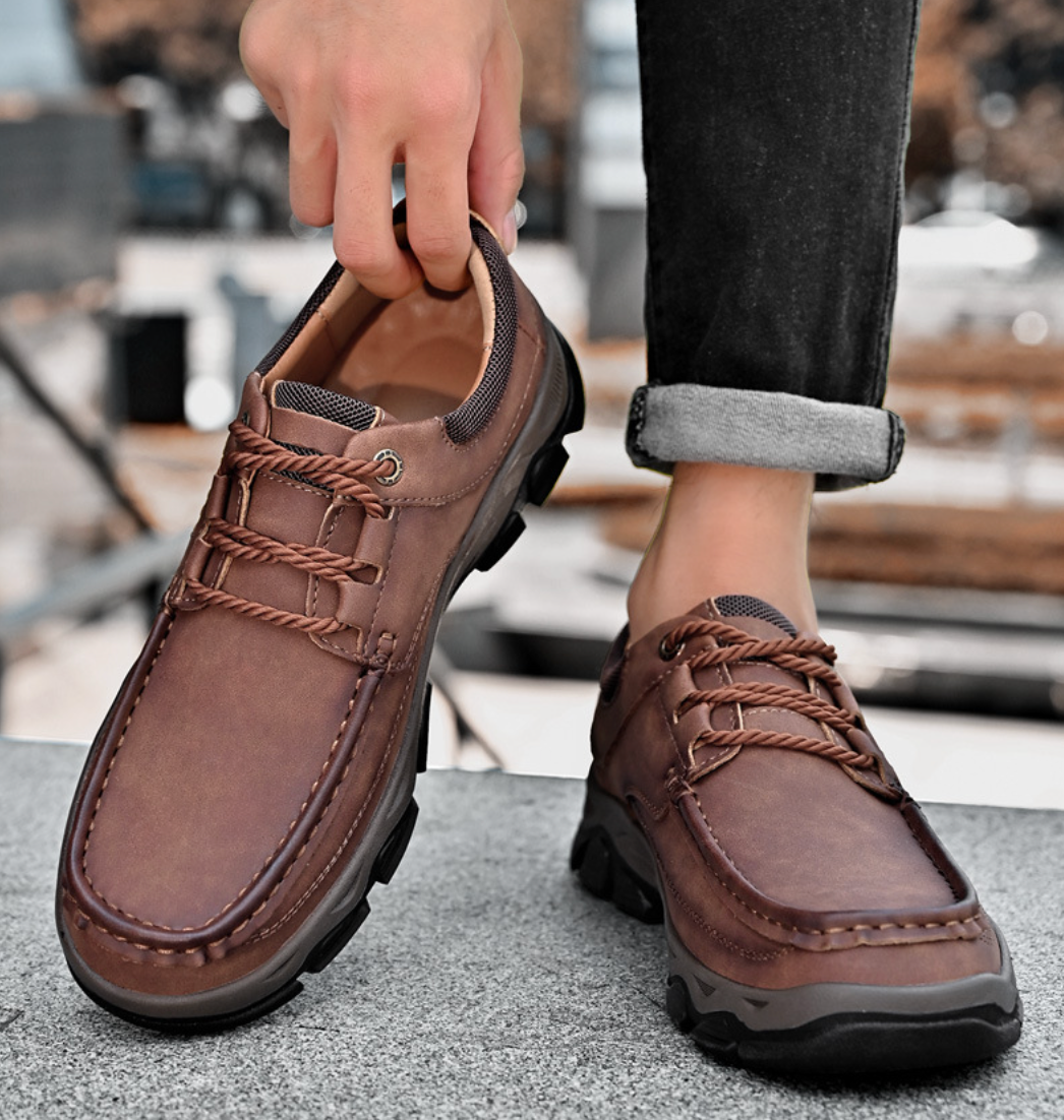 Sleek black orthopedic men's shoes, providing stylish comfort and excellent arch support.