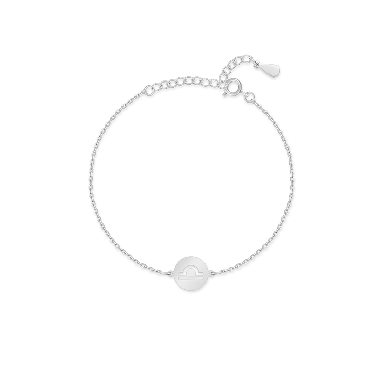 Woman's wrist adorned with a gold plated sterling silver Lyra Zodiac adjustable bracelet