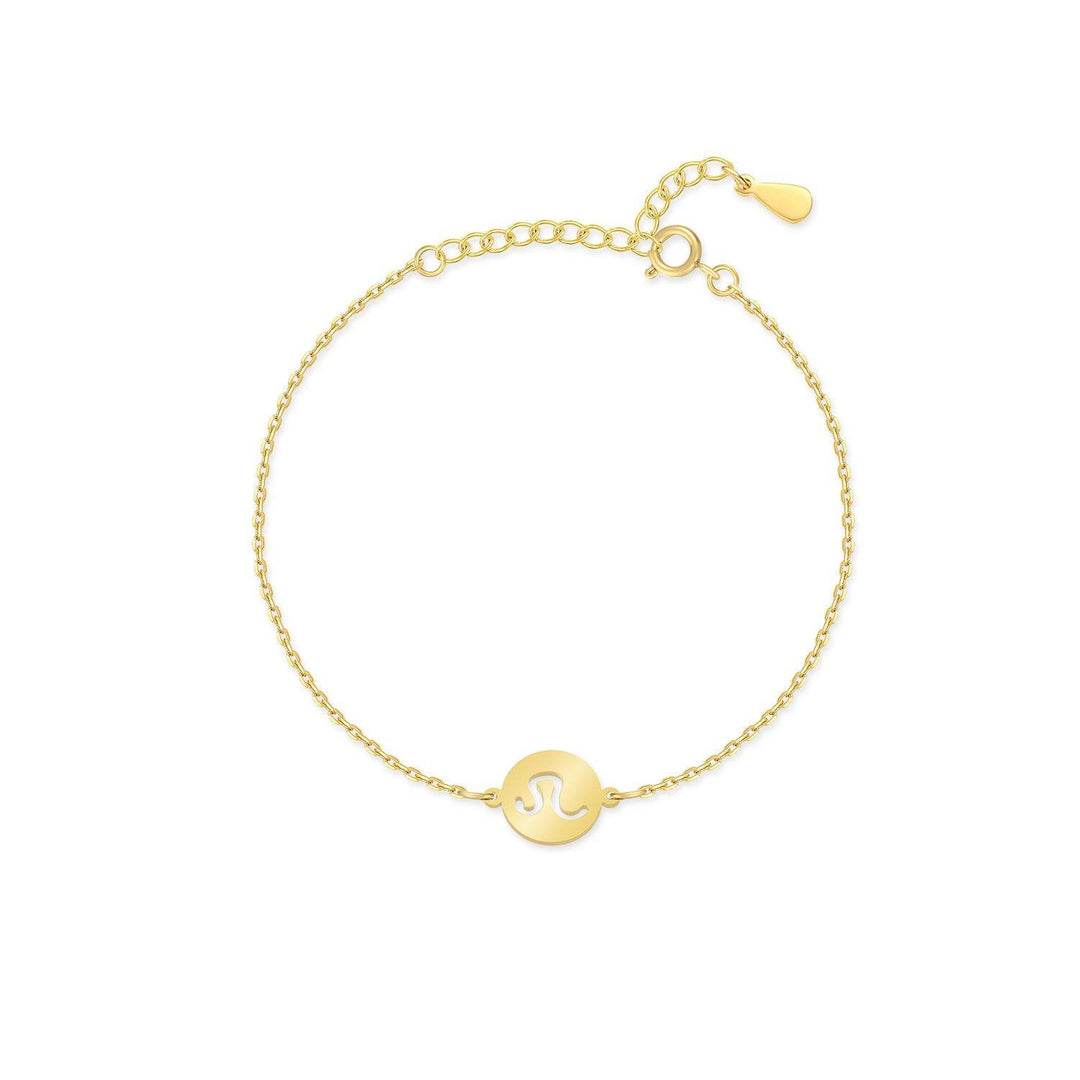 Gold plated sterling silver Lyra Zodiac bracelet displayed on a velvet cushion, luxury women's jewelry