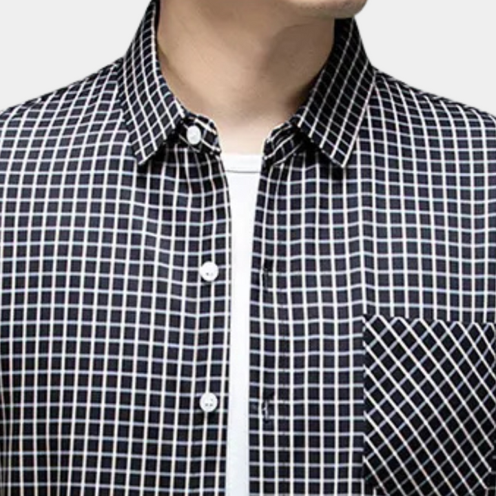 High-quality men's black checked button-down shirt. Comfortable long-sleeve casual top, easy to style.