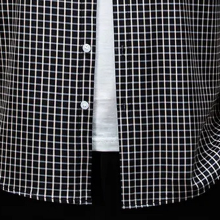 Versatile men's black checked button-down long-sleeve shirt. Ideal for layering or as a stand-alone piece.