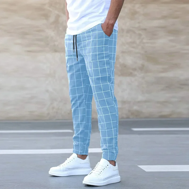 Stylish men's checkered joggers with a modern tapered fit, perfect for casual streetwear and comfort.
