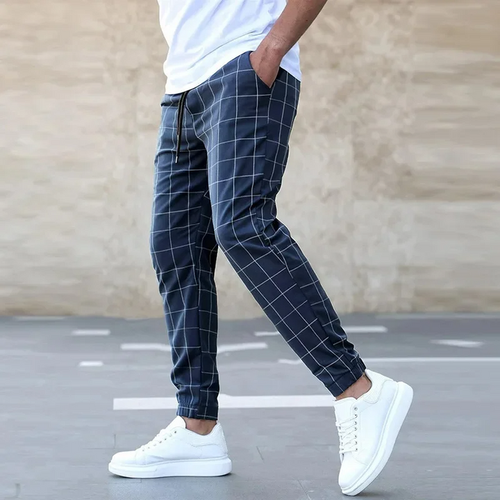 Black checkered men's athletic joggers, tapered fit, designed for modern comfort and active lifestyles.