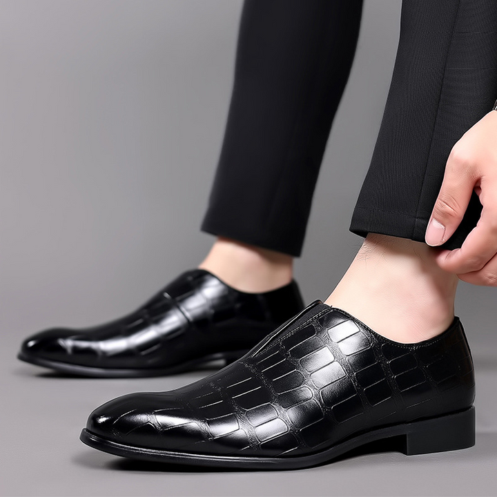 Detailed view of men's stylish croc-embossed comfort loafers, highlighting the unique pattern & texture.