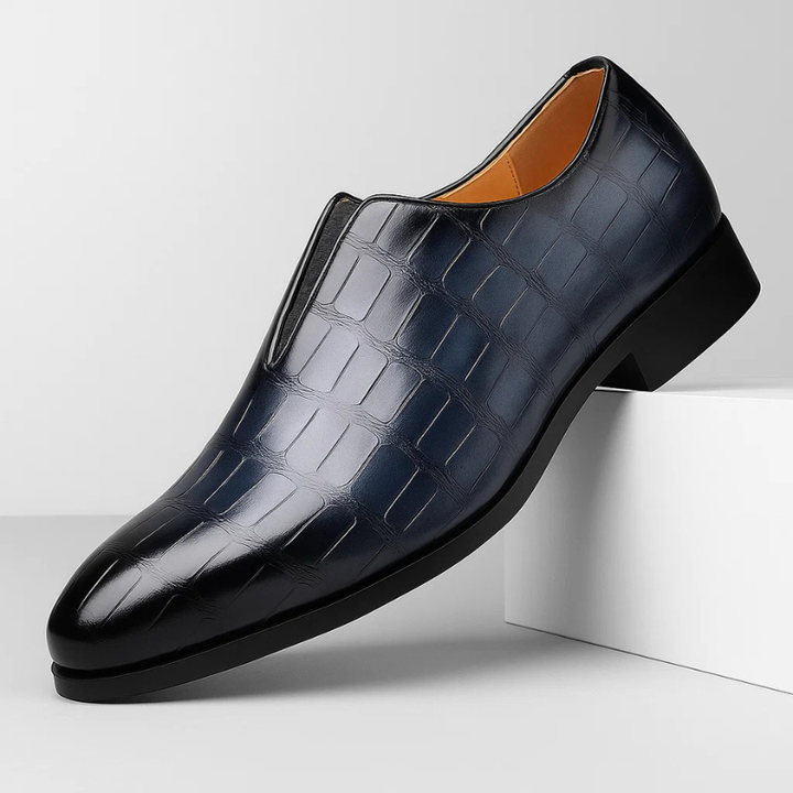 Men's slip-on comfort loafers with a distinct croc-embossed pattern, perfect for a stylish look.