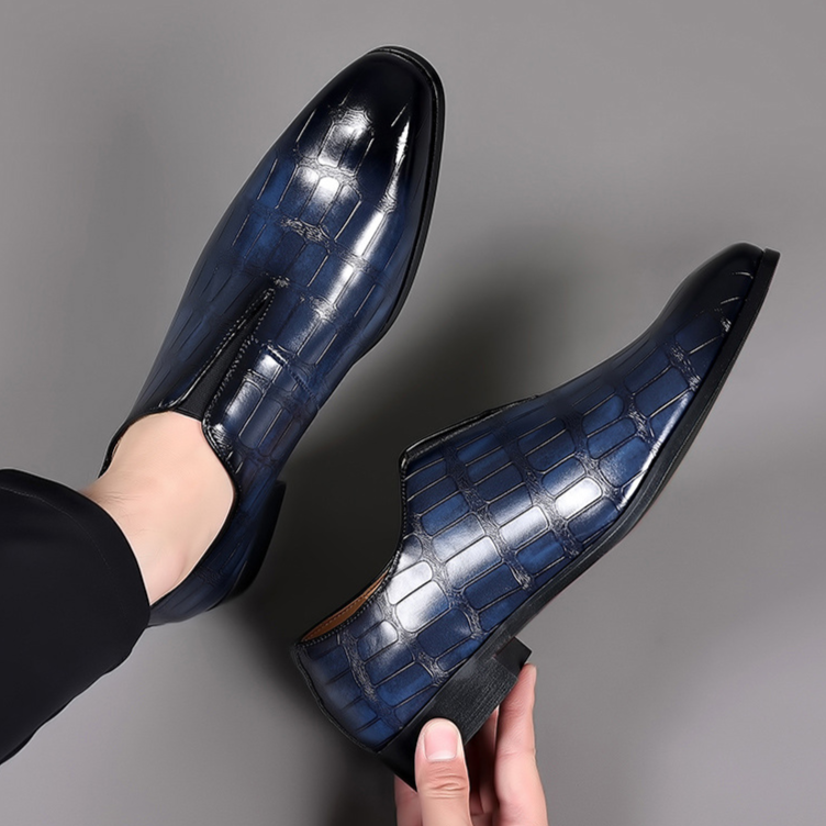 Modern men's croc-embossed comfort loafers, combining stylish design with practical slip-on ease.