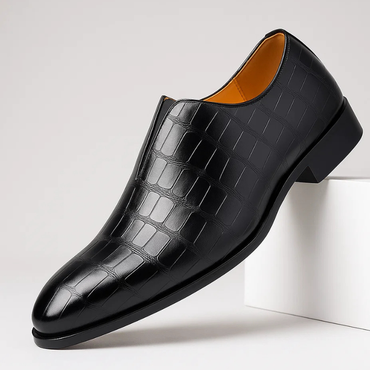 Men's stylish slip-on loafers featuring a unique croc-embossed pattern for refined casual elegance.