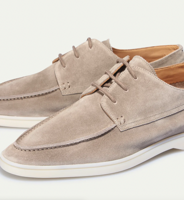 Side profile of sleek men's slip-on loafers, showcasing their modern design & comfortable fit for all day.