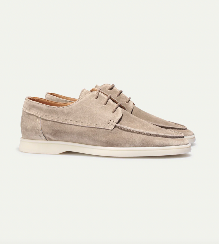 Men's stylish loafers on foot, demonstrating comfortable fit & elegant look for various occasions.