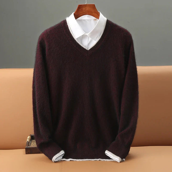 Man modeling a men's onyx V-neck sweater, showcasing its comfortable fit and timeless, casual elegance.