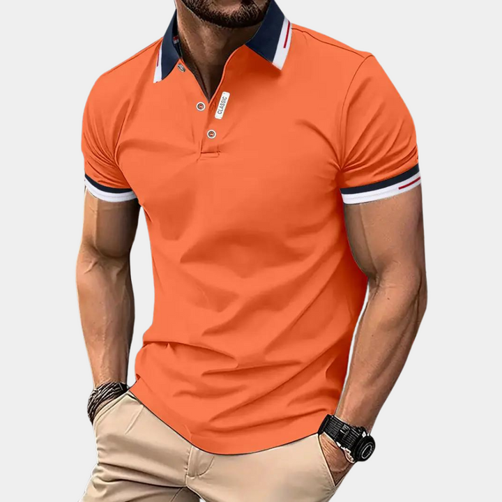Stylish men's orange polo shirt by Jules, perfect for a casual yet refined summer look.
