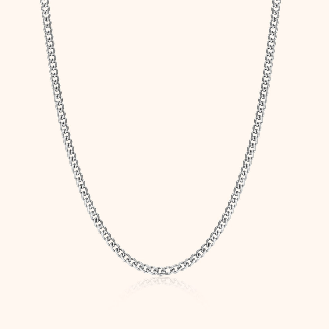 Stylish men's silver Cuban link necklace. Classic and durable men's chain, essential jewelry for fashion.