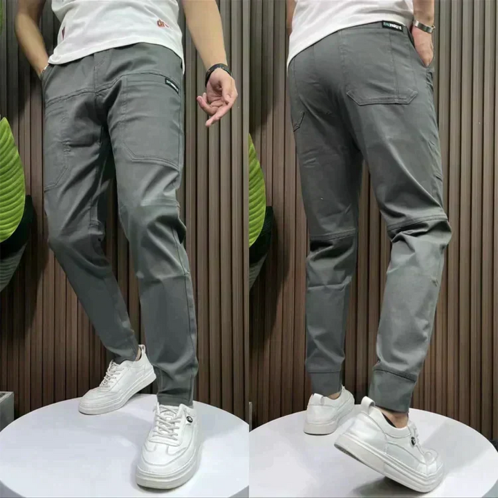 Stylish men's slim-fit cargo trousers in gray, comfortable stretch fabric for casual modern wear.