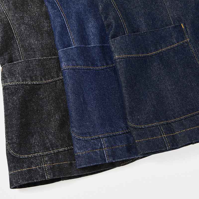 Detail shot of the men's structured blazer's contrast stitch on utility pocket, highlighting unique design.