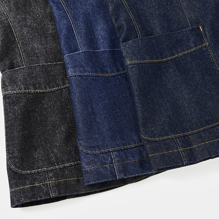 Detail shot of the men's structured blazer's contrast stitch on utility pocket, highlighting unique design.