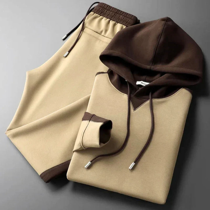 Stylish men's two-tone lounge set, modern relaxed fit. Comfortable casual wear for modern men's fashion.