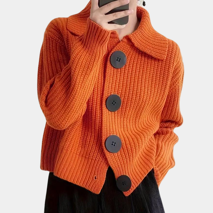 Versatile orange women's vest, a fashionable sleeveless top for seasonal layering and everyday wear.