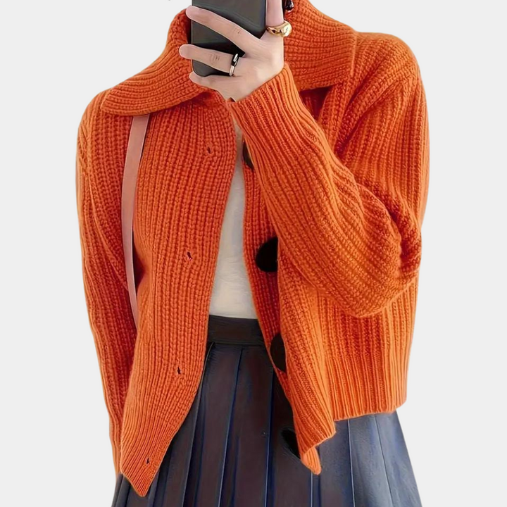 Trendy orange women's vest, ideal for a modern apparel look and versatile layering style.