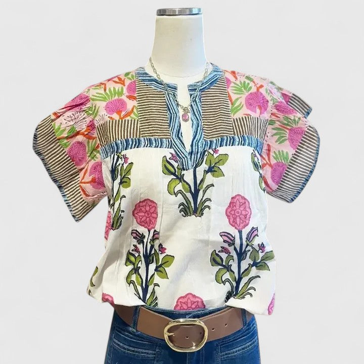 Stylish pink women's blouse with intricate bohemian embroidery, relaxed fit for elegant summer or spring comfort.