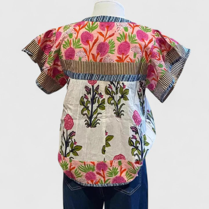 Comfortable women's embroidered pink blouse, perfect for casual chic spring and summer outfits with a relaxed fit.