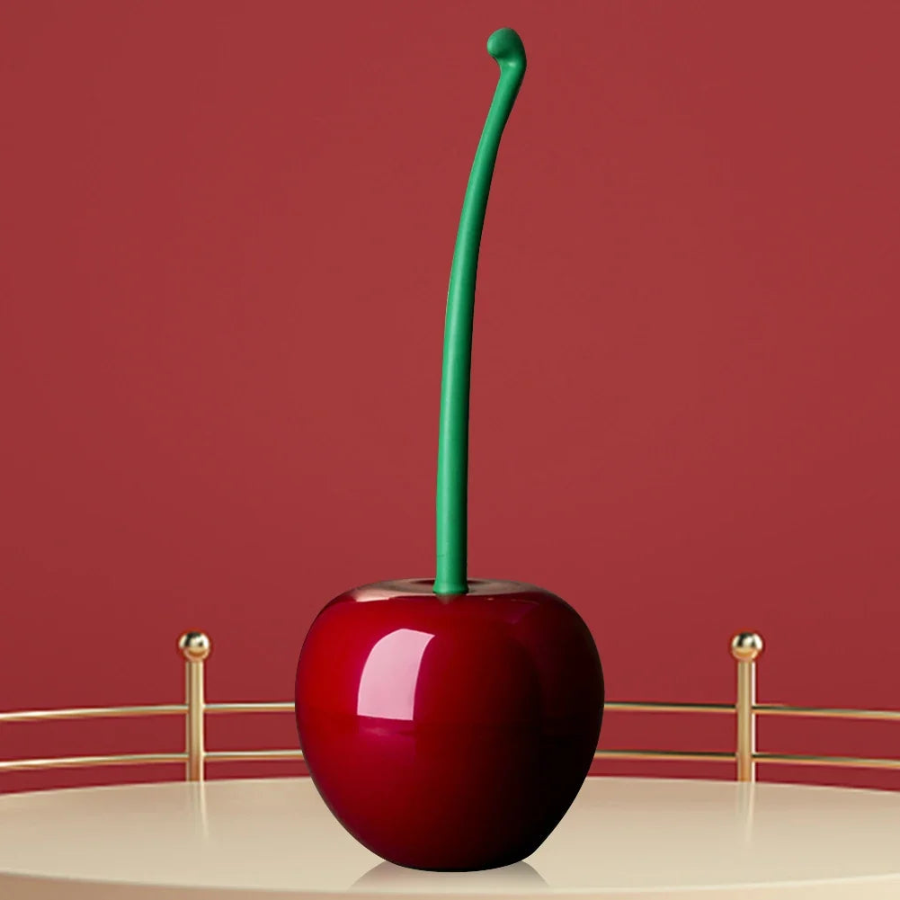 Modern cherry bomb toilet brush in vibrant red. Practical & stylish cleaning tool for effective bathroom hygiene.