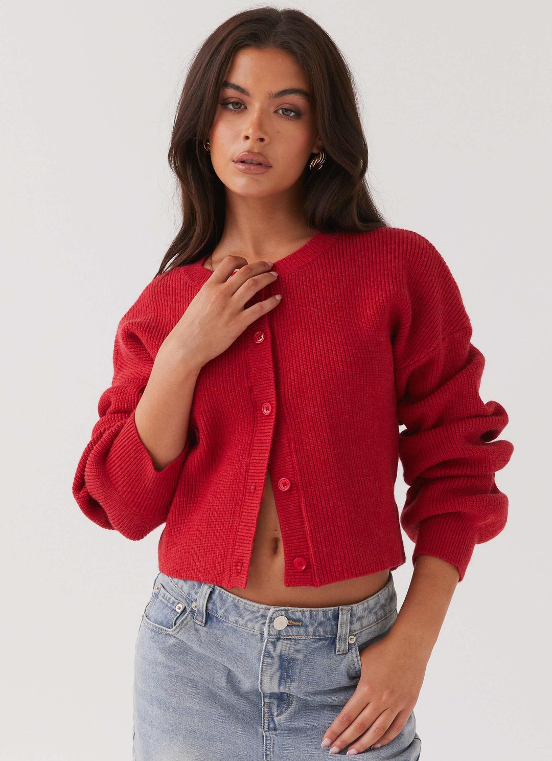 Stylish red women's cardigan with button-front, perfect for layering. Long sleeve, versatile for casual or work wear.