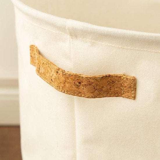 Modern round cotton linen storage basket. Versatile home decor item, ideal for laundry, toys, or general organization.