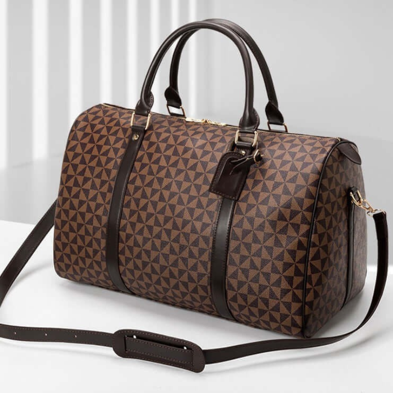 Elegant duffle bag, a versatile unisex travel accessory for stylish weekend trips & gym use. Carry-on friendly.