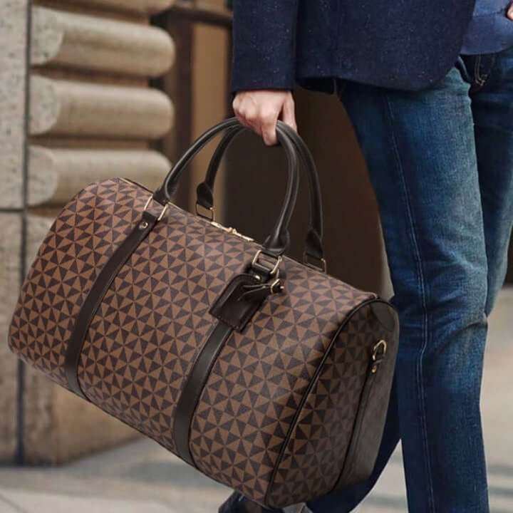 Spacious carry-on duffle bag, perfect as a unisex gym bag or weekend travel accessory. Durable & stylish design.