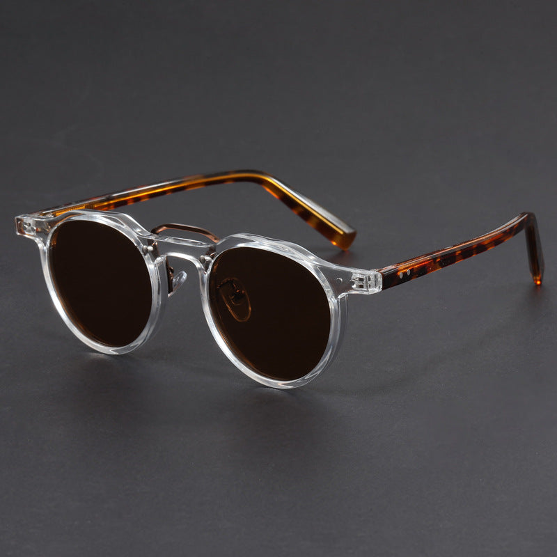 Stylish unisex UV400 sunglasses, modern black frame, offering essential eye protection for sunny days. Lightweight eyewear.