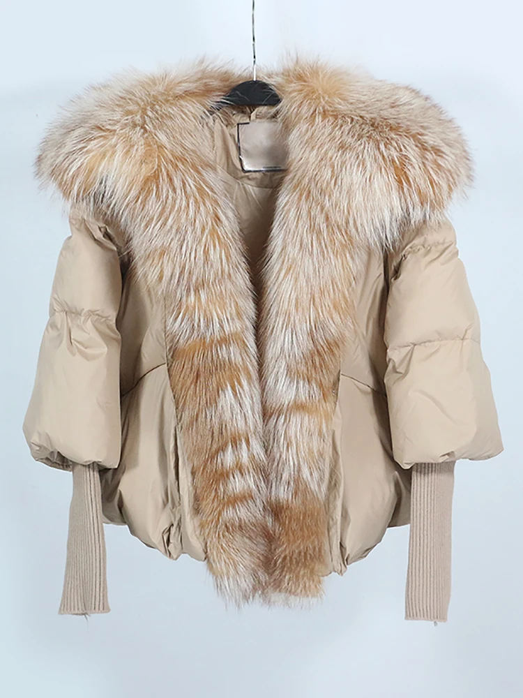 Person wearing a stylish unisex puffer jacket outdoors in winter, staying warm and comfortable in cold weather.