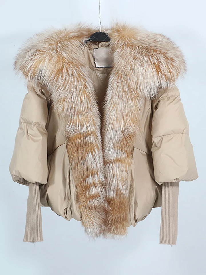 Person wearing a stylish unisex puffer jacket outdoors in winter, staying warm and comfortable in cold weather.