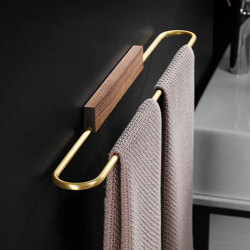 Stylish walnut and brass modern towel bar for bathroom. Elegant wood & metal home decor and storage.